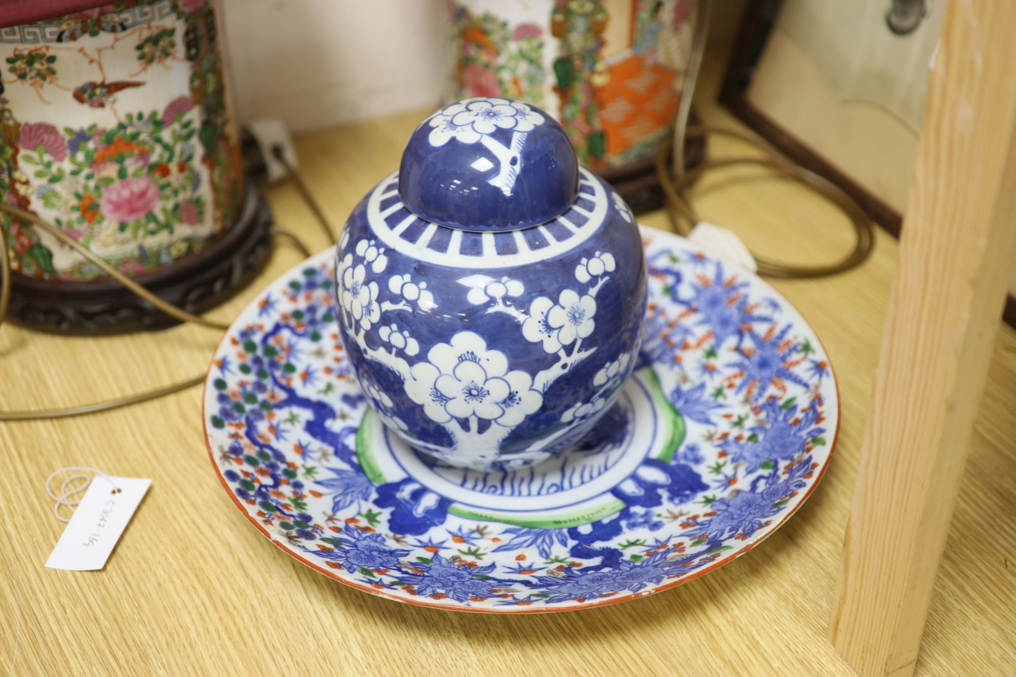 A pair of Chinese famille rose table lamps, 35cm high to lamp fitting, a blue and white jar and cover, a dish and a horse print